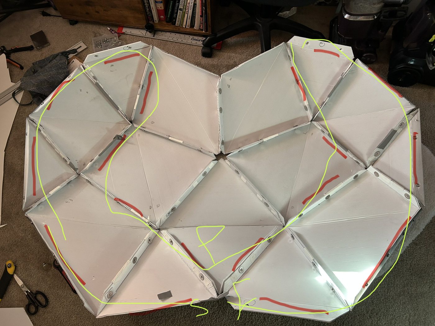 Interior of the v1 shell with LED strips placed and a routing plan drawn over the photo